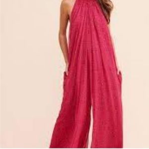 Free People silky wide leg floral jumpsuit with pockets.
